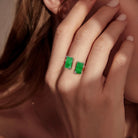 A semi-open jade ring inlaid with two jades and diamonds