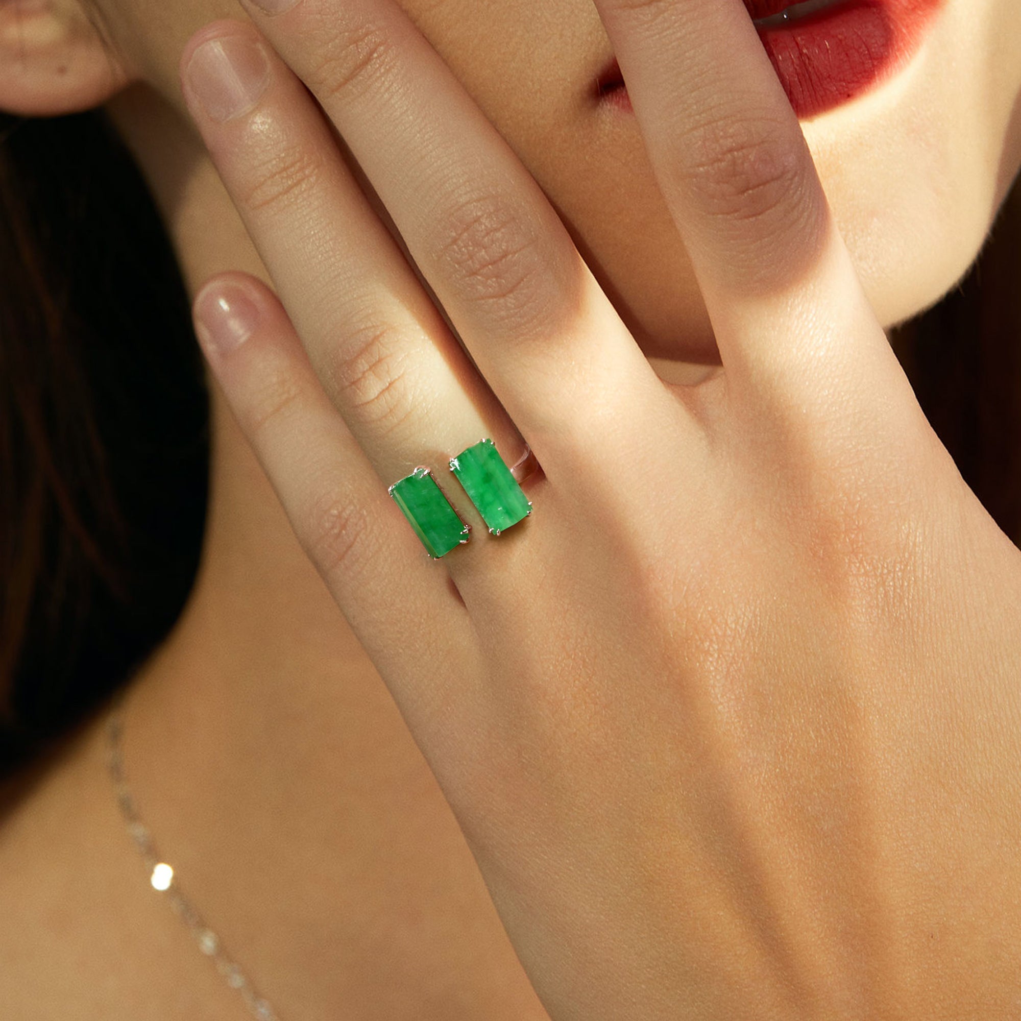 Model wearing a semi-open jade ring with two jade stones